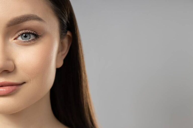 Attractive young girl on a gray background. Botox concept