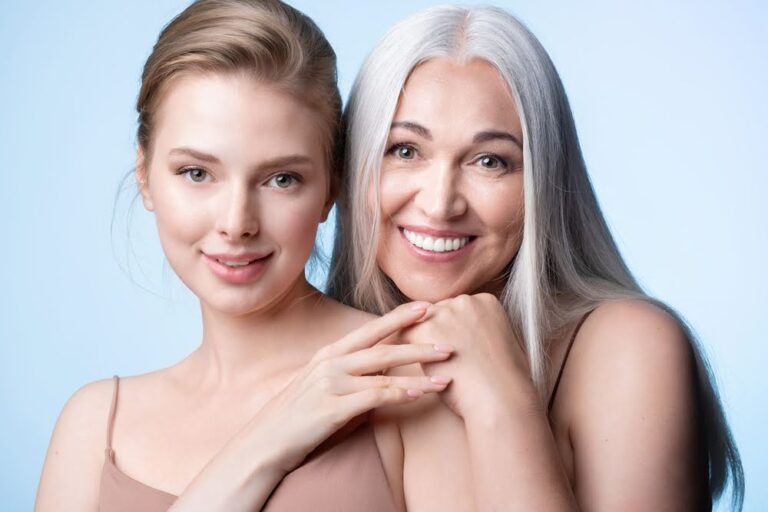 Beautiful female generations. Smiling young woman and mature mother hugging. Elderly gray-haired mum and adult daughter enjoying tender moment, cuddling, holding hands, happy family leisure together