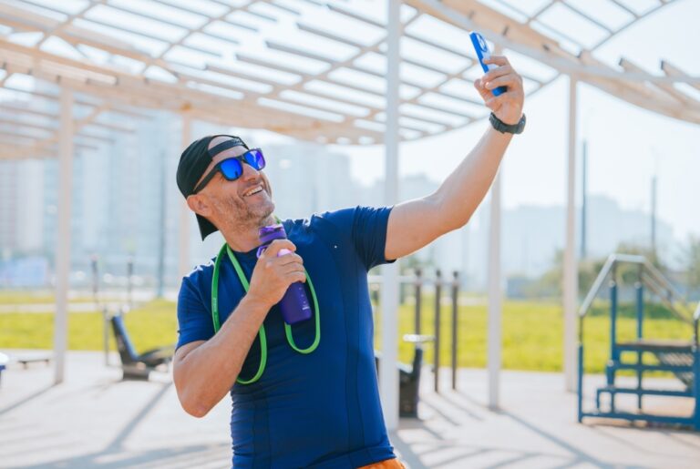 Man,In,Sportswear,And,Sunglasses,Takes,A,Selfie,While,Holding