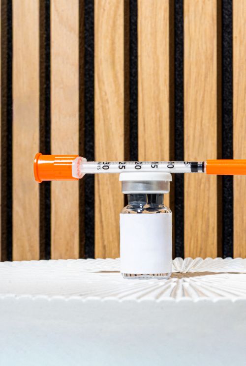 Vial of peptide and syringe