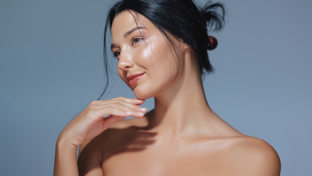 A woman with radiant, glowing skin highlighting the results of a traditional facial at Relive Med Spa in Brentwood TN.